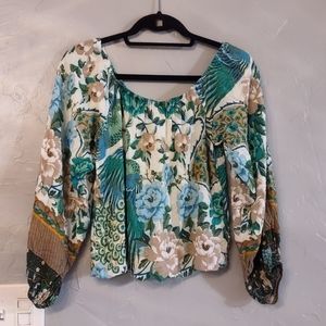 Moon Kara blouse junior XL perfect for any occasion.With its multicolor floral